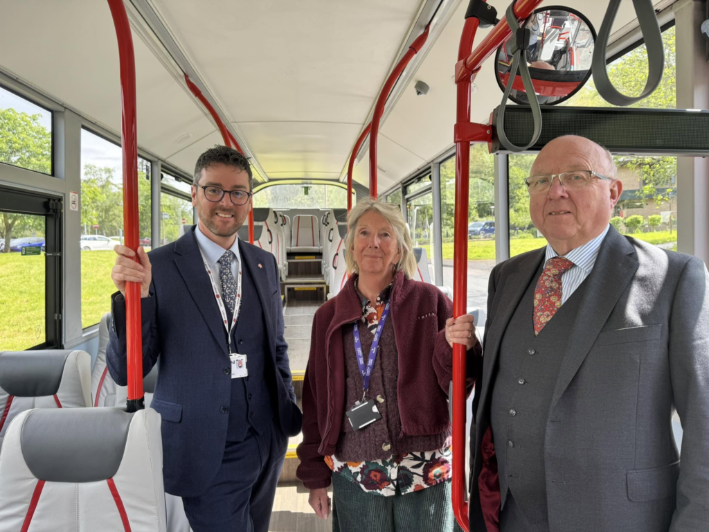 Cllrs Matthew Dorrance, Liz Rijnenberg and David Meredith on a bus